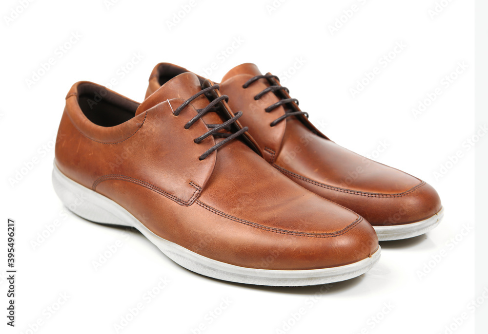 Brown mens shoes pair isolated on white.Elegant claaasic shoes. Brown mens shoes pair isolated on white.Elegant claaasic shoes.