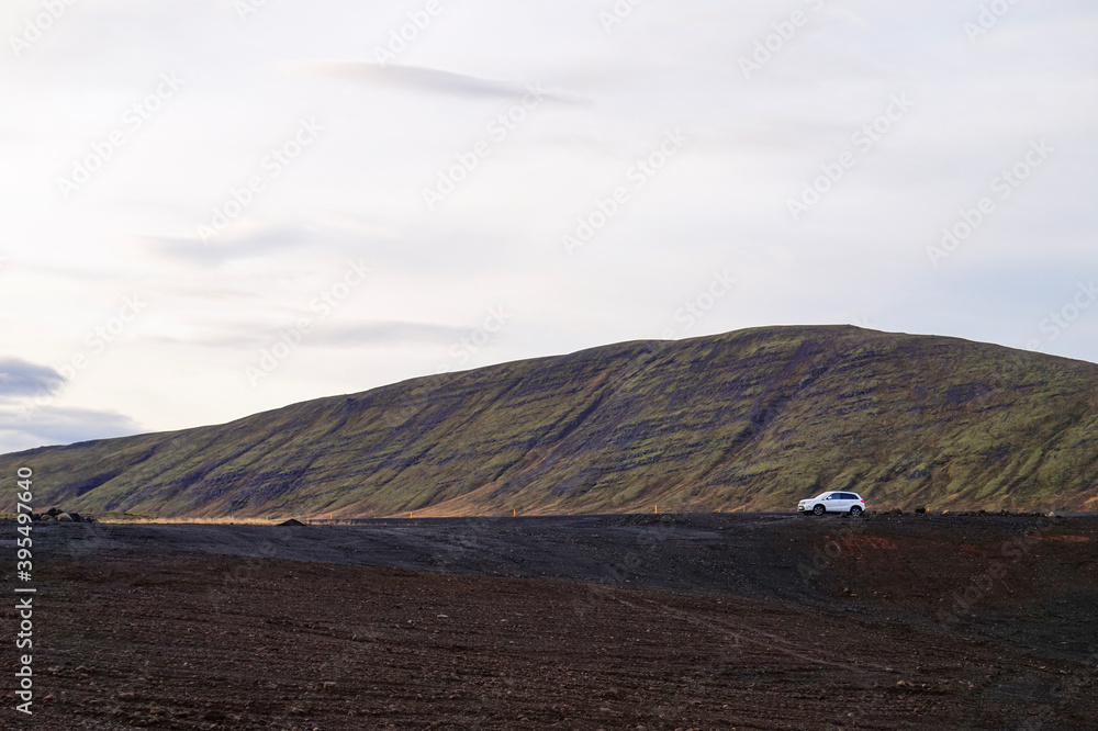 Obraz premium SUV against a dramatic landscape