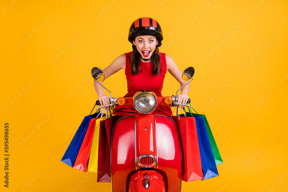 Photo of impressed lady wear dress headwear sitting retro bike holding colorful shopping bags isolated yellow color background