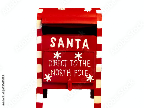 Red Santa Claus mailbox close-up with text Direct to the North Pole isolated on white

