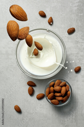 Almonds falling into almond milk