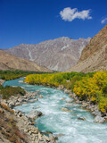 Colorful scenic landscape view of the Gunt river valley with turquoise blue water and golden foliage, Gorno-Badakshan, Tajikistan Pamir