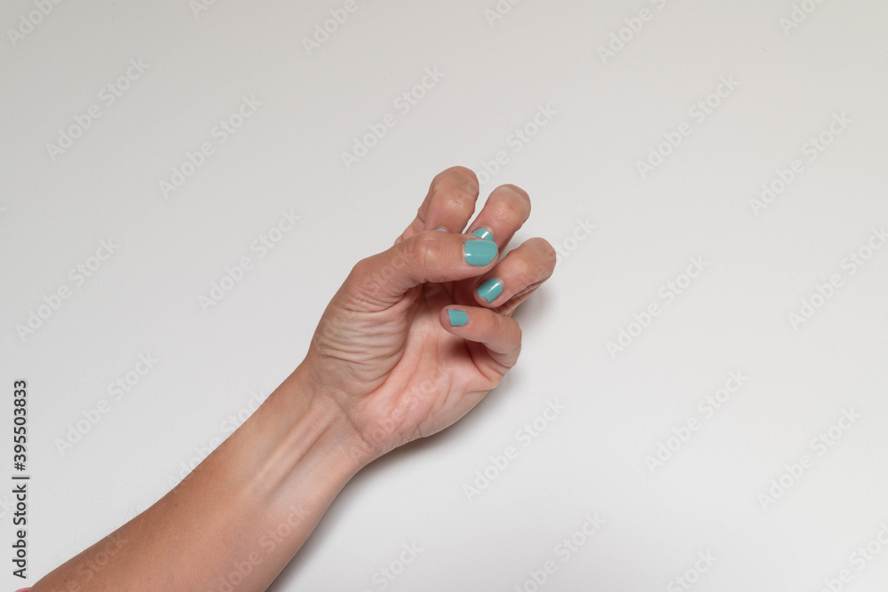 Half closed hand symbolizing hatred or anxiety on white background Half closed hand symbolizing hatred or anxiety on white background
