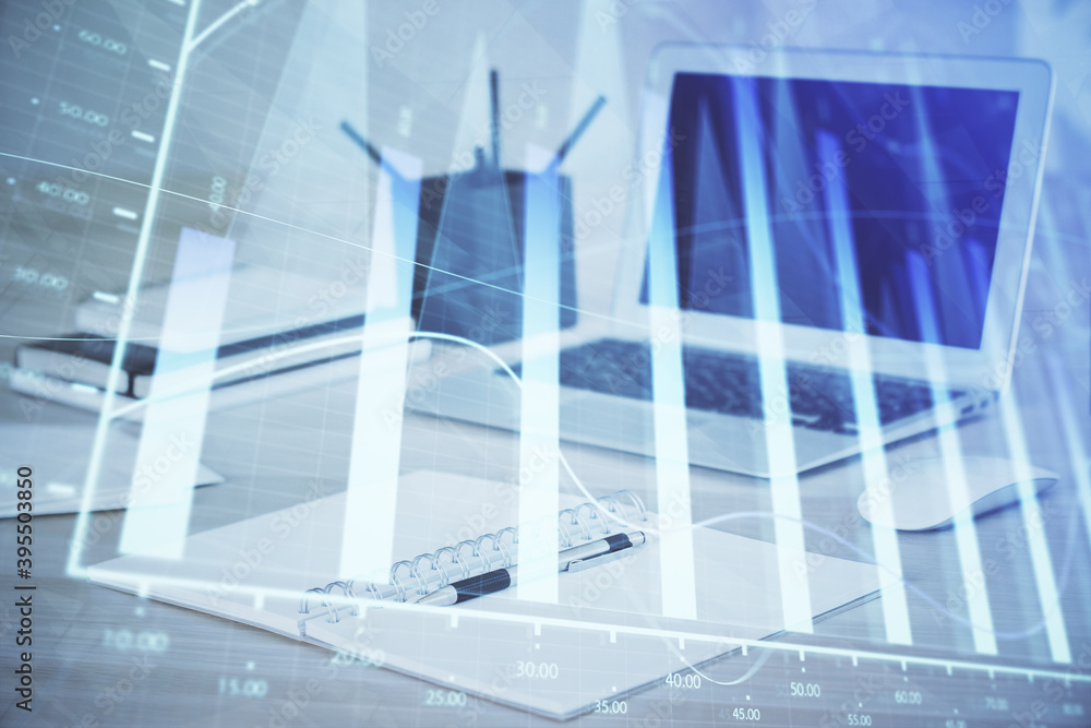 Obraz premium Forex graph hologram on table with computer background. Multi exposure. Concept of financial markets.