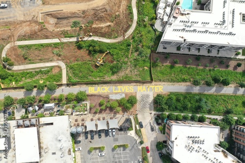 "Black Lives Matter" Written on the Atlanta Beltline in Yellow Letters - Atlanta, GA, Aerial View