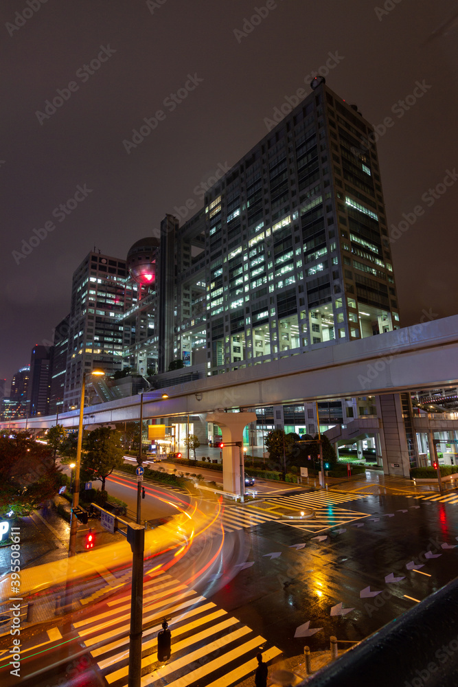 Fuji TV building at night in Daiba district in Tokyo (Japan)