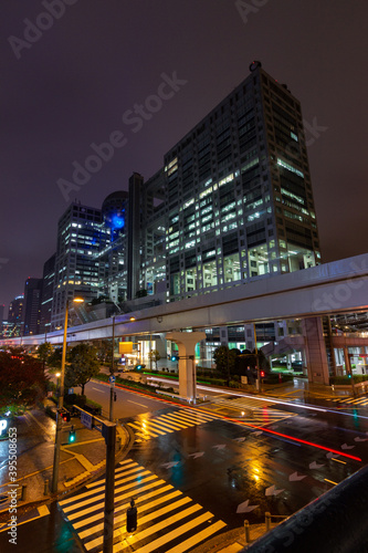 Fuji TV building at night in Daiba district in Tokyo (Japan)