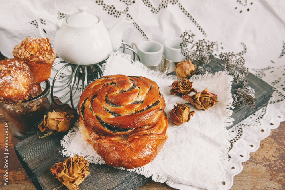 Puff pastry, sliced poppy seed roll, sweet poppy seed bun on a white