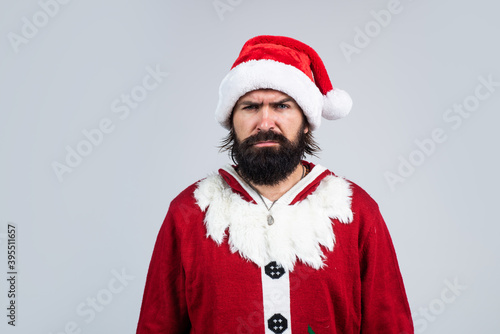 brutal bearded guy in santa claus costume on christmas eve, new year