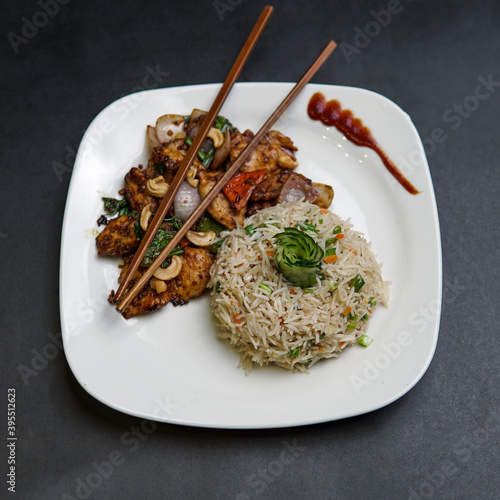 Chinese rich round shape with chicken machurian in a plate photo