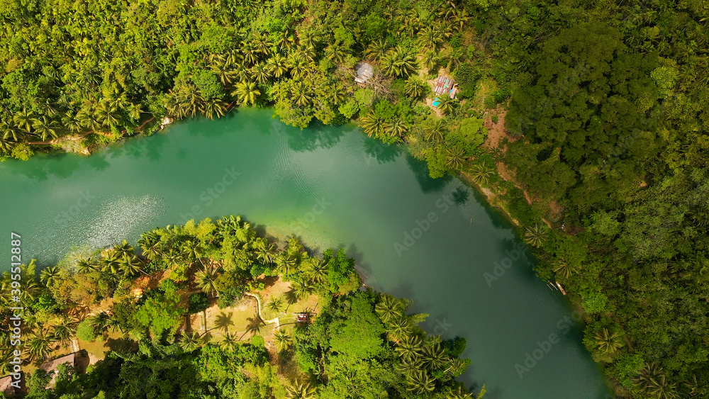 Aerial view of Loboc River in tropical green jungle. Bohol, Philippines.