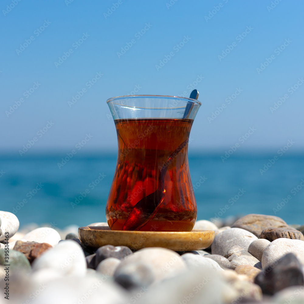 Armudu. Tea in a glass on the beach. Armudu. Tea in a glass on the beach.