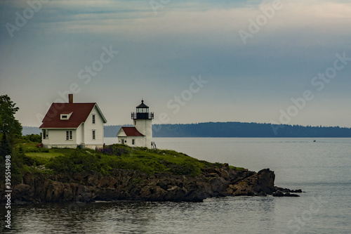 Small lighthouse in the harbor of Camden, Maine photo