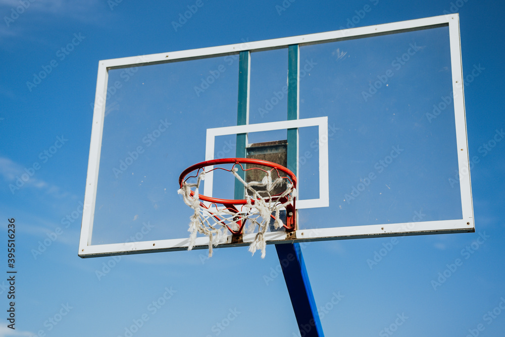 basketball hoop against sky. basketball net on sunny summer day