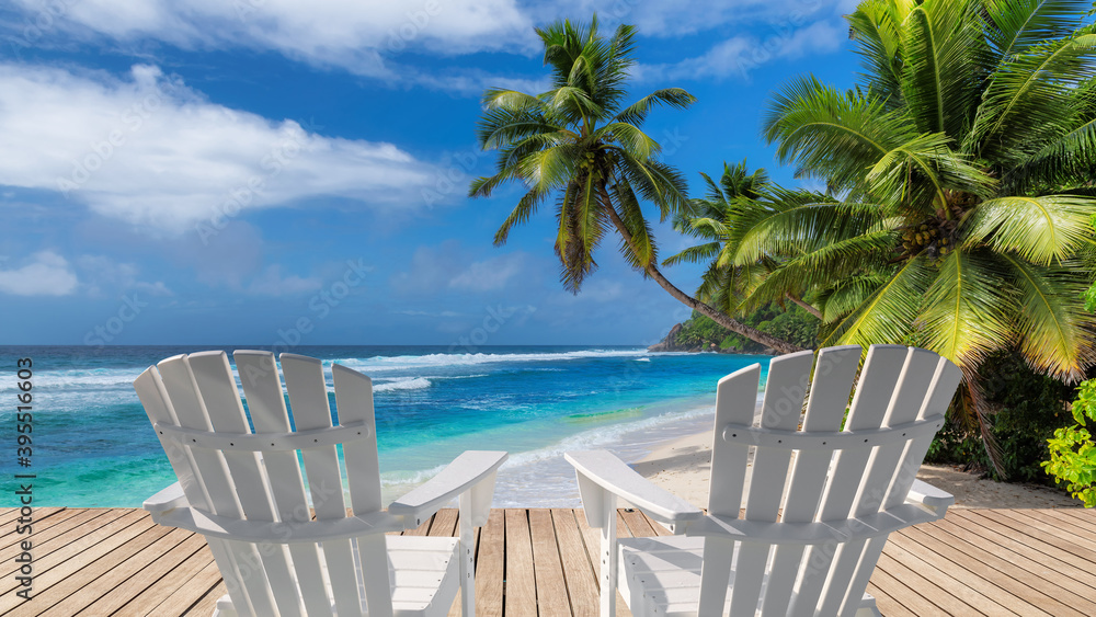 Vacations Sunny beach with white beach chairs on wooden floor, palm trees and the turquoise sea on Tropical island.	