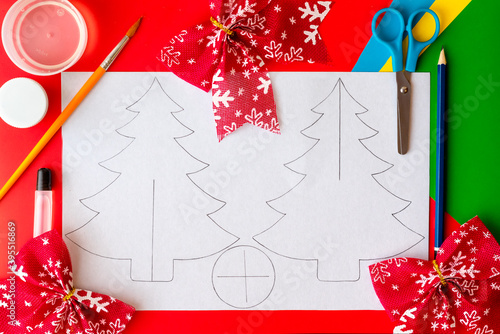 Christmas craft. DIY cardboard Christmas tree, step-by-step instructions on how to make a fir tree. Step 1 - Draw or copy two tree outlines and a base on cardboard