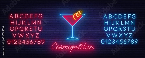 Cocktail Cosmopolitan neon sign on brick wall background. Red and blue neon alphabets.