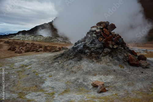 Boiling mudpots in the geothermal area Hverir and cracked ground around, Iceland in summer. Myvatn region, North part of Iceland photo