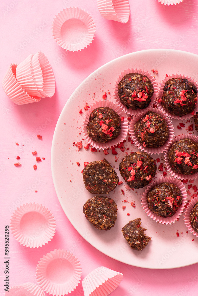 Sugar free, raw, vegan, energy protein balls made with dates, almonds, coconut oil, cocoa nibs and freeze dried strawberries Sugar free, raw, vegan, energy protein balls made with dates, almonds, coconut oil, cocoa nibs and freeze dried strawberries