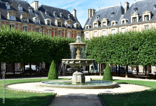 Fountain at Place des Vosges, the oldest square in the city located at Le Marais district. Paris, France.