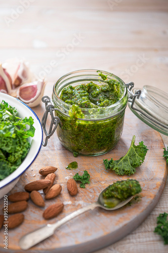 Homemade kale and almond pesto with garlic, olive oil and sea salt photo