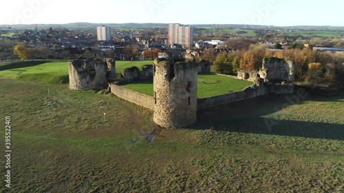 Historical Flint castle medieval military ruins landmark aerial view fast left orbit photo