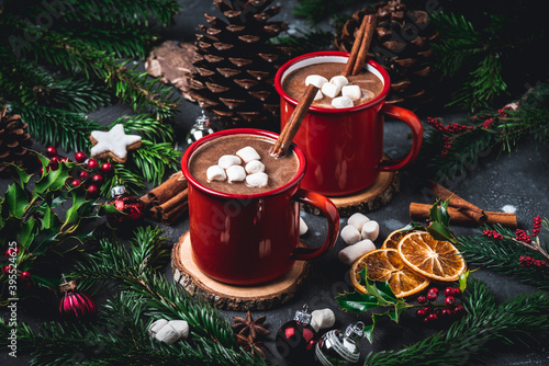 Hot chocolate with marshmallows in red enamel mugs