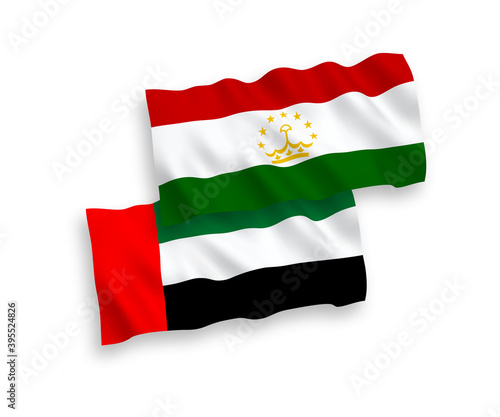 National vector fabric wave flags of Tajikistan and United Arab Emirates isolated on white background. 1 to 2 proportion.