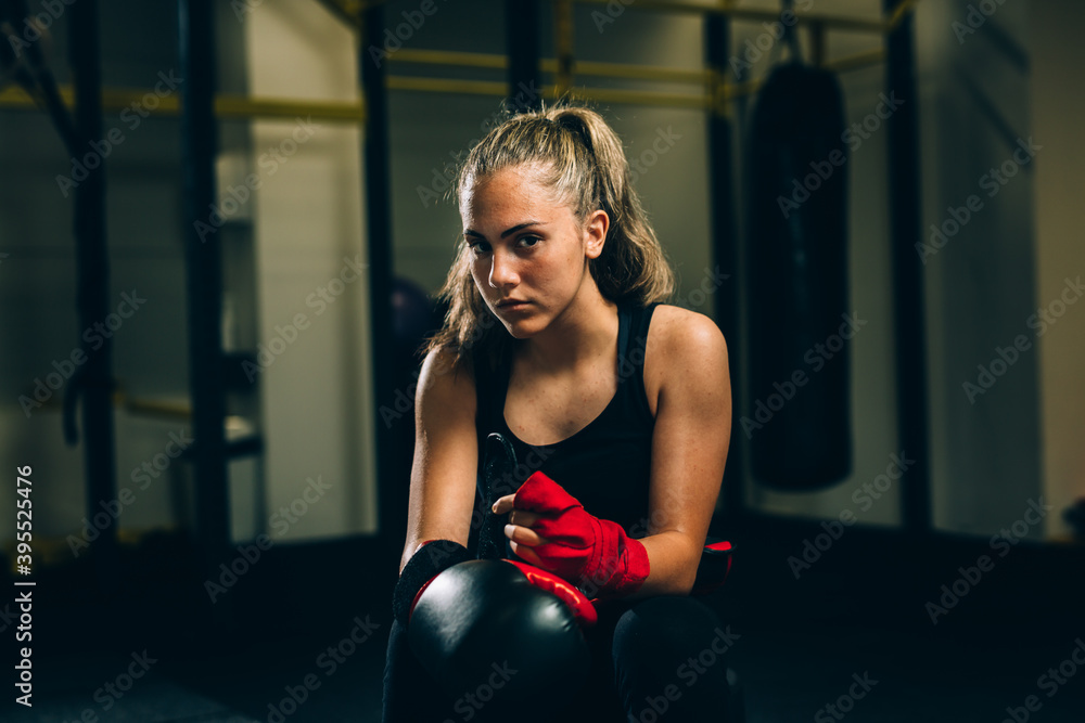 young woman preparing for boxing training