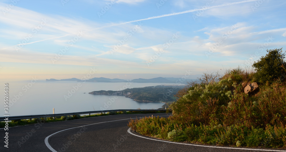 coastal road in alghero, sardinia, italy