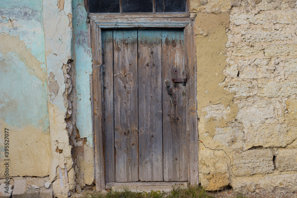 wooden door in an old stone house