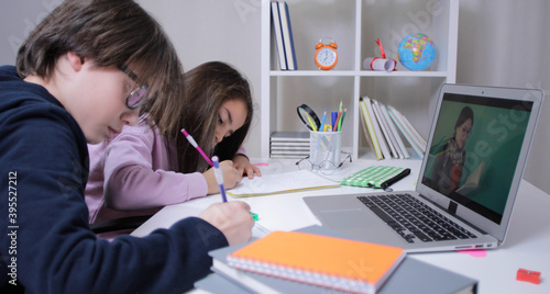 child studying on laptop