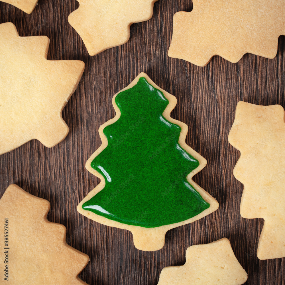 Top view of decorated Christmas tree cookie on wooden table background with copy space. Top view of decorated Christmas tree cookie on wooden table background with copy space.
