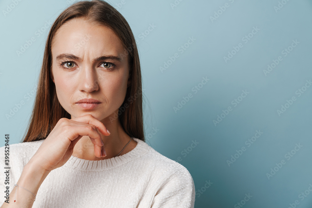 Displeased beautiful woman posing and looking at camera Displeased beautiful woman posing and looking at camera