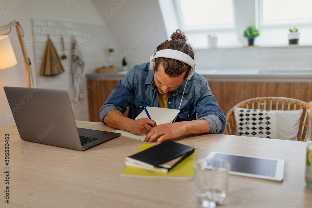 Young man learning at home Young man learning at home