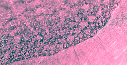 Pink foam in the sink as an background.