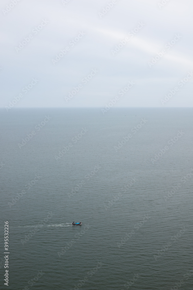 seascape sky ocean and mini fishing boat seascape sky ocean and mini fishing boat