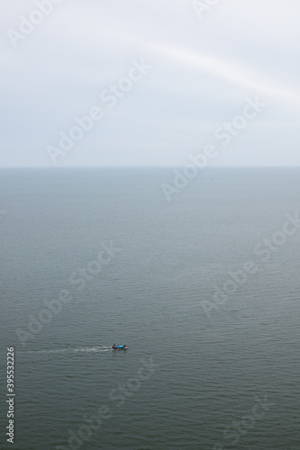seascape sky ocean and mini fishing boat