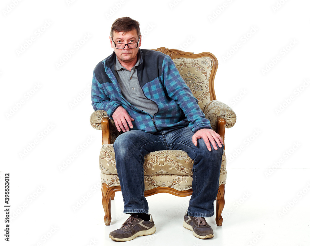 man in a comfortable vintage chair made of wood on a white background