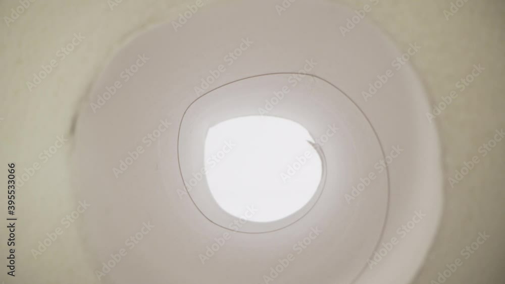 White soft paper and a light feather. The concept of purity freshness and lightness. White soft paper and a light feather. The concept of purity freshness and lightness.