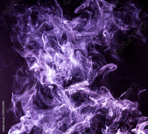 Purple smoke isolated on black background. Abstraction