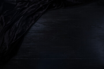Dark wooden table for product display montage, Elegant black table setting napkin on black wooden background