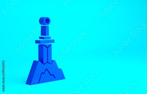 Blue Sword in the stone icon isolated on blue background. Excalibur the sword in the stone from the Arthurian legends. Minimalism concept. 3d illustration 3D render. © Kostiantyn