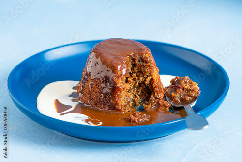 Hot toffee pudding with toffee sauce photo