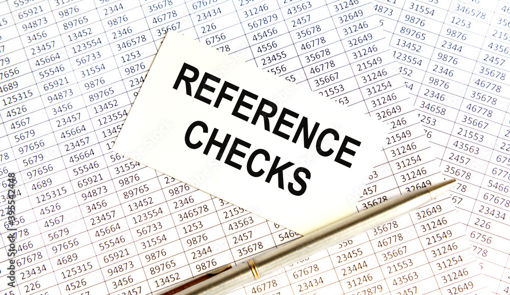 On the business card, the text RATEPAYERS, next to the pen, all on the background of reports. On the business card, the text RATEPAYERS, next to the pen, all on the background of reports.