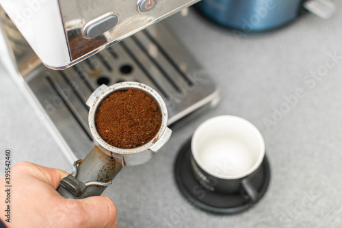 Preparation for making coffee in a coffee machine. Ground coffee poured.