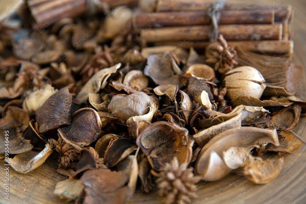 Top view of dried wood pieces in round wooden plate.. Top view of dried wood pieces in round wooden plate..