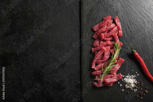 Roaw Beef Goulash on a stone kitchen cutting board. photo