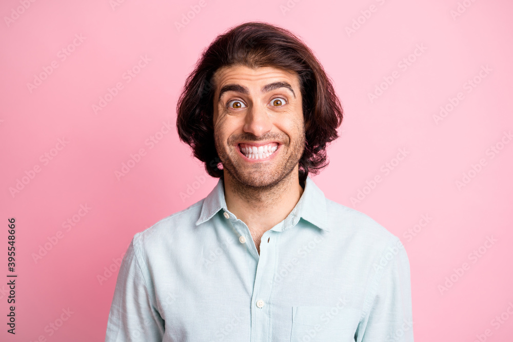 Fototapeta premium Close up photo of delighted young man impressed face look camera isolated on pastel pink color background