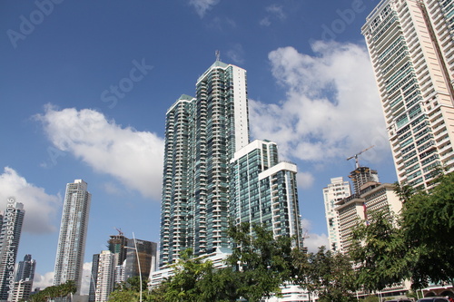 group of skyscrapers with blue sky background with clouds on a summer day © cristhian
